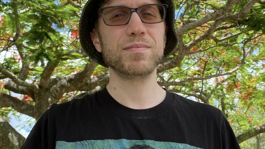 Ben Friedman headshot in front of trees