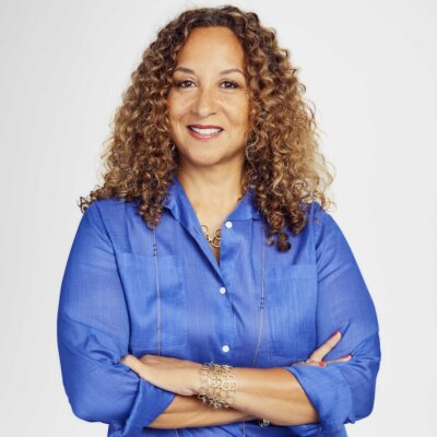 Karen Horne smiling headshot wearing a blue jacket